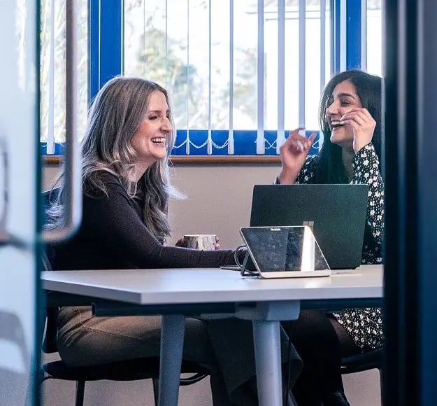 Emma and Simran laughing together